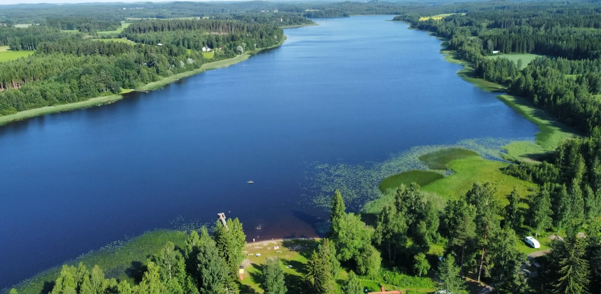 Aerial view of the lake at Taika Camping